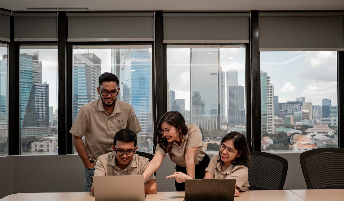 Technology professionals collaborating around business systems